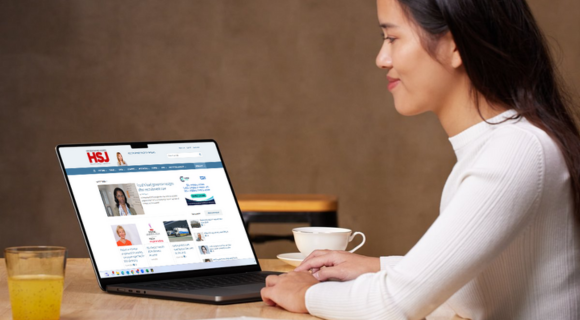 woman reading hsj news from a laptop screen